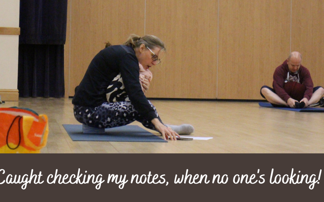 Jayne, of Ad Astra Yoga and Pilates, checking her class notes