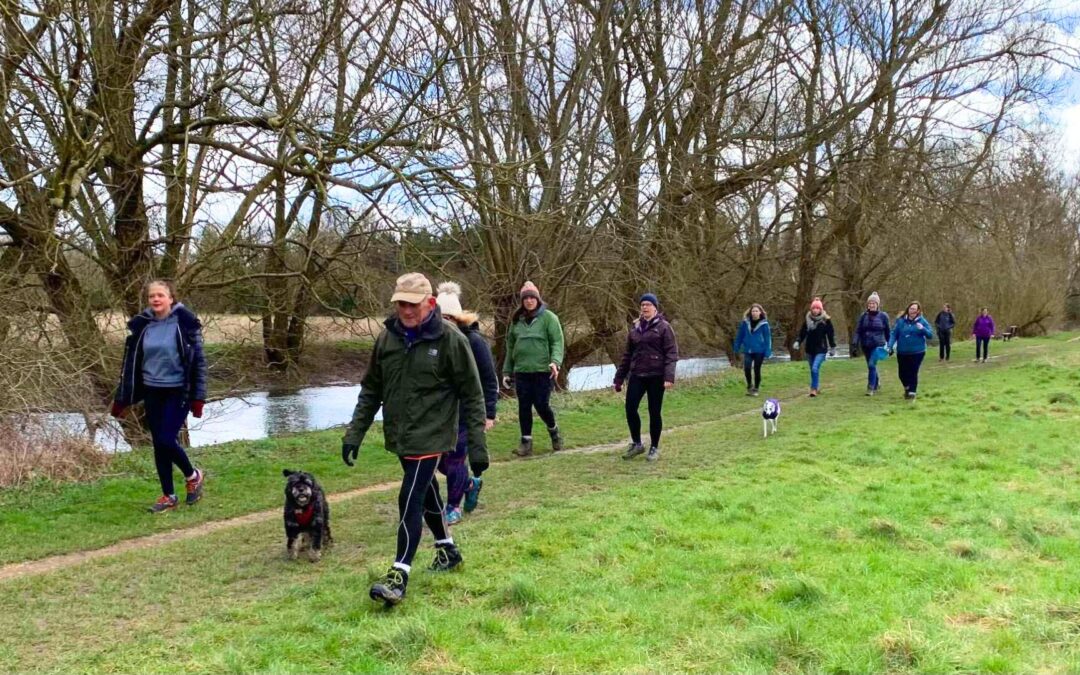 A group of Ad Astra Yoga and Pilates members walking along the river in Witney